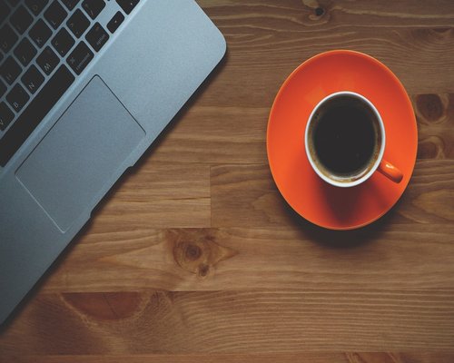 A cup of coffee on a modern office desk